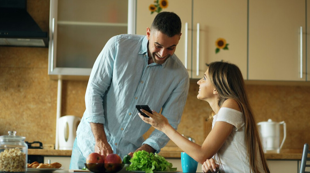 family discussing budget at kitchen table