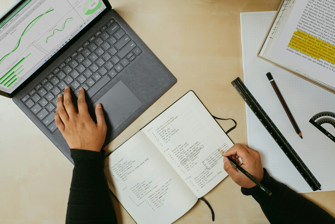 person planning budget on laptop